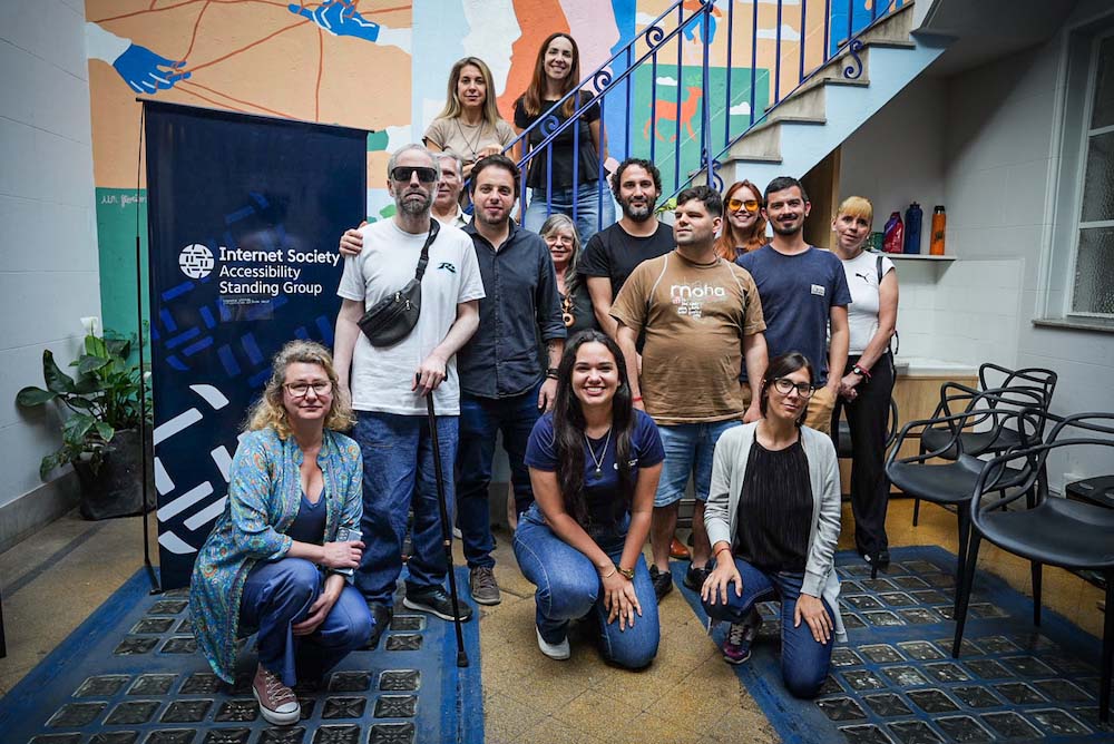 A group of people at an Accessibility Standing Group event with Asuntos Del Sur
