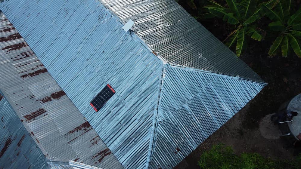 The roof of a building with a piece of Internet infrastructure attached
