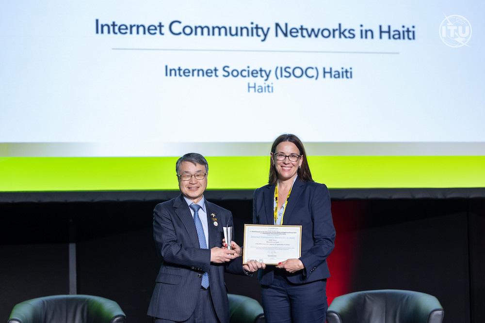 Sally Wentworth accepts the WSIS Prize Champion Award on behalf of the Internet Society Haiti Chapter